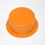 Safety button cover for industrial machinery.